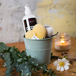 A soothing basket with local lotion, bathbomb and beeswax candle. 