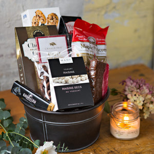 What's better than a gift basket full of chocolate and sweets! This gift includes chocolate pretzels, a coffee truffle bar, fudge, maple popcorn, a selection of chocolate cookies, and more.