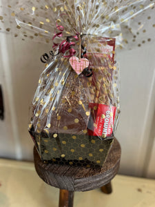 Sweets for your sweetie, this basket has chocolate pretzels, fudge, chocolate pizza slice, cookies and more. Plus a keepsake pottery heart ornament 