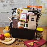 This basket contains a selection of local crackers, tortilla chips, and salsa from Barrie's Asparagus, fudge, chocolate pretzels, Rootham's red pepper jelly or chutney, maple popcorn, plus cookies, truffles, pretzels 